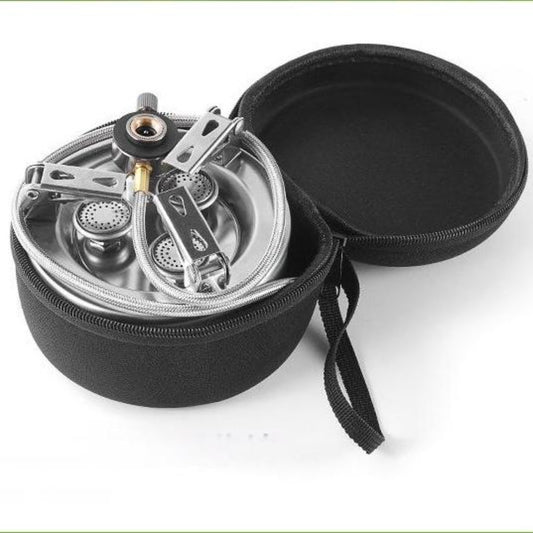 Top view of STARCAMP round camping stove showing three individual burner heads inside round stainless steel body