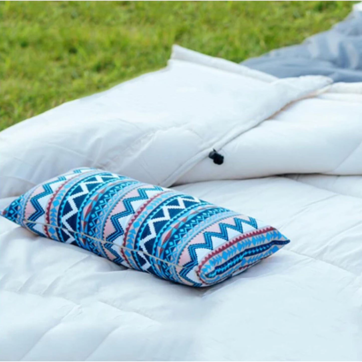 Boho ethnic foam camping pillow compressed to compact 18 x 13cm storage size for easy packing in bag or backpack