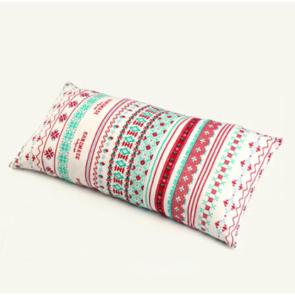 Close up of boho camping pillow bold ethnic zigzag geometric pattern in navy, pink, blue, red and white on cotton cover