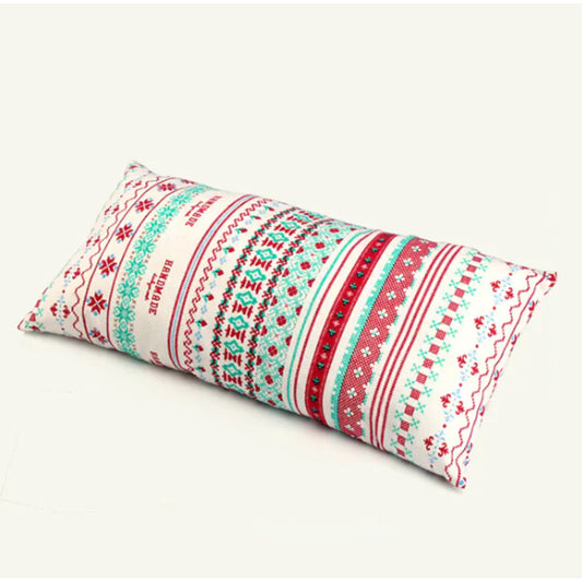 Close up of boho camping pillow bold ethnic zigzag geometric pattern in navy, pink, blue, red and white on cotton cover