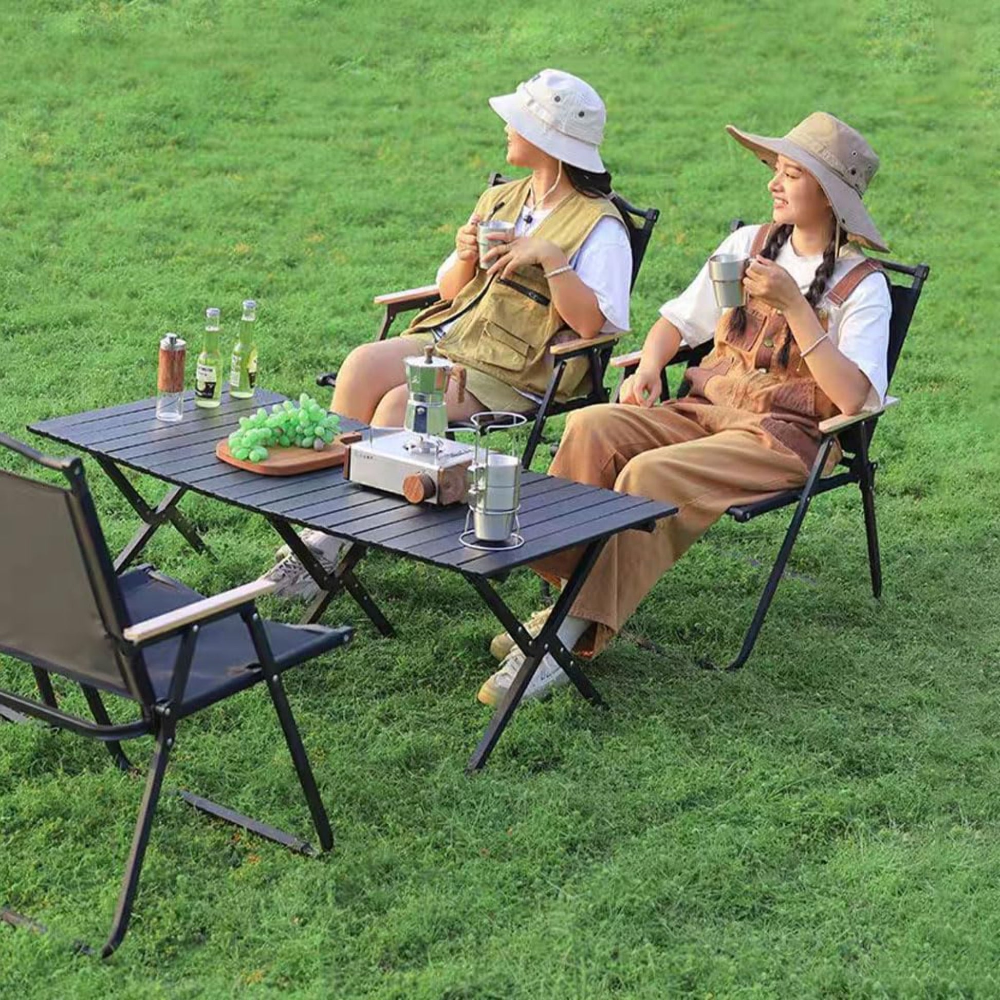 Close up of foldable camp chair curved decorative steel top rail and frame construction