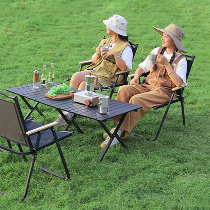 Close up of foldable camp chair curved decorative steel top rail and frame construction