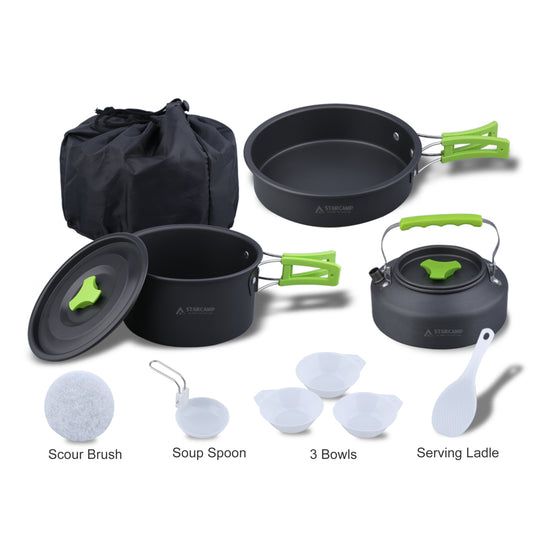 Camping cookware set with pots, pans, kettle, and utensils on a white background