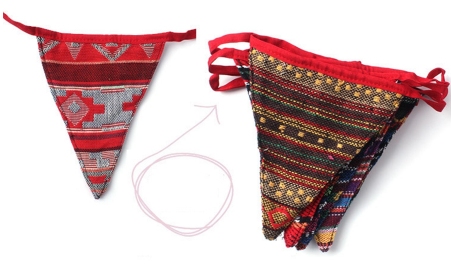 Ethnic boho pennant bunting flags spread out showing variety of different geometric ethnic patterns on each triangular flag