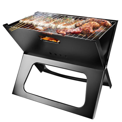 Portable grill with food being cooked on a white background