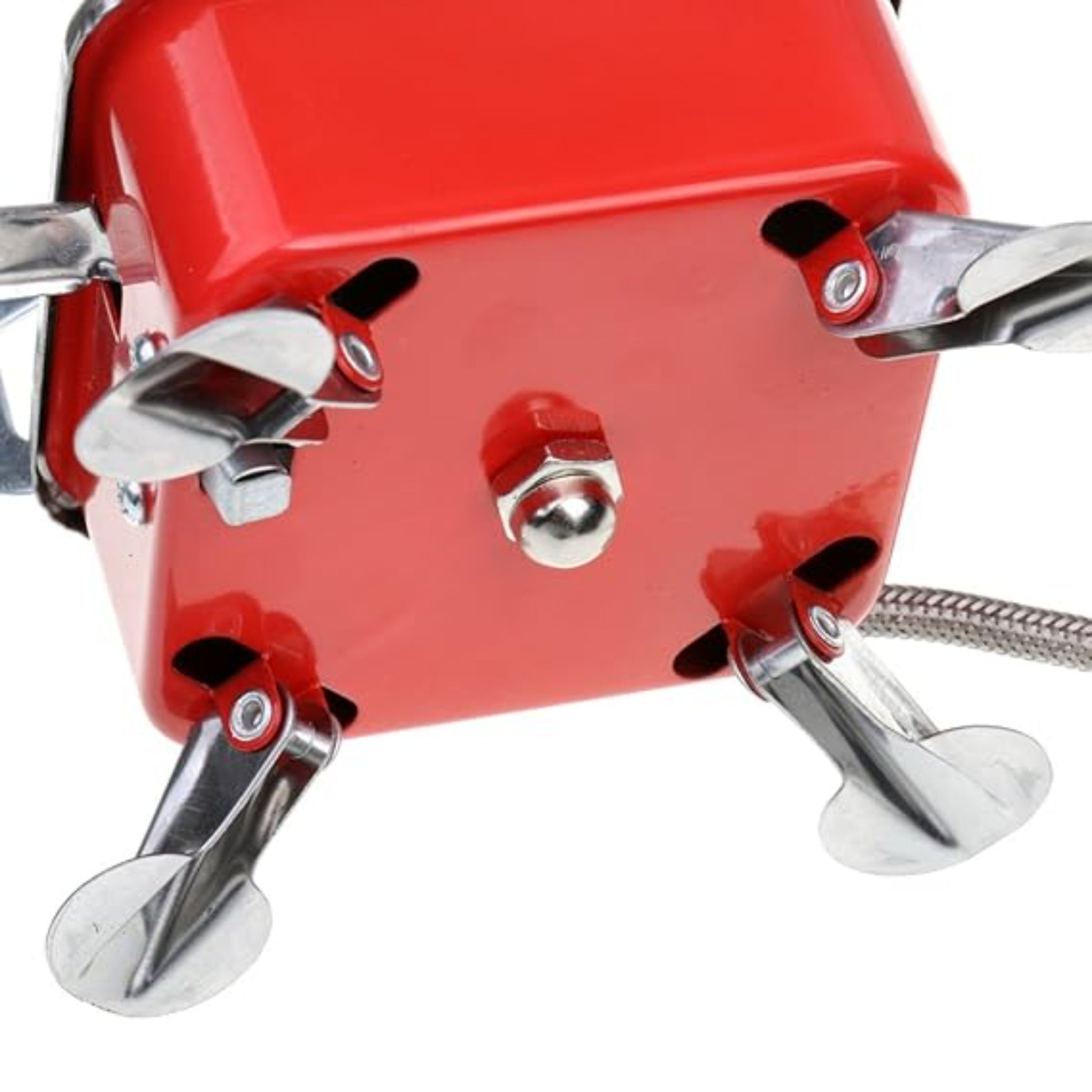 Close up of mini square camping stove flexible braided extension hose with brass gas canister connector for remote canister use