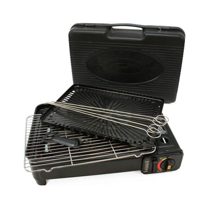 Portable grill with accessories in a black carrying case on a white background