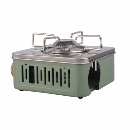 Green camping stove with metal pot holder on a white background