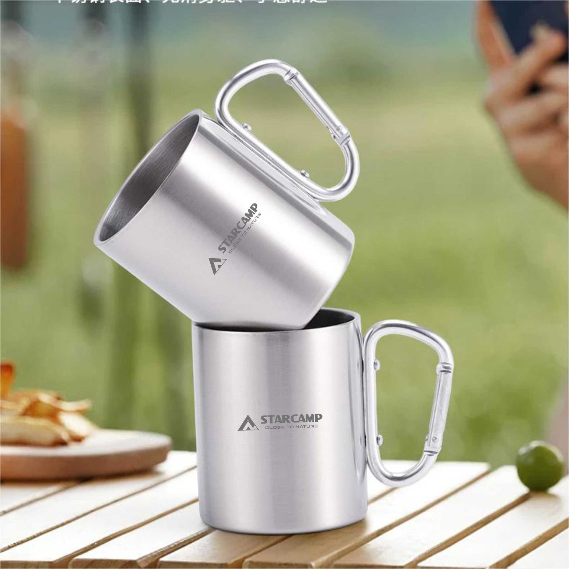 Close up of STARCAMP engraved logo and branding on polished stainless steel camping mug body