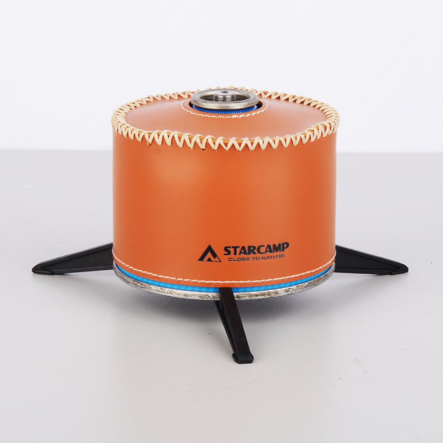 Top view of STARCAMP gas canister stand showing triangular central ring and three outward folding legs