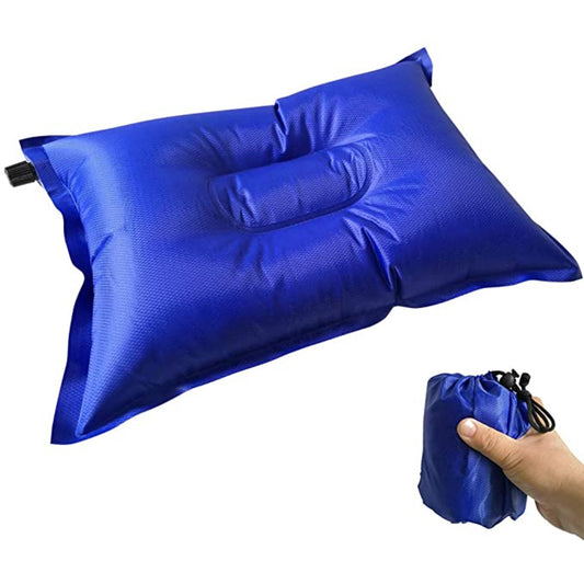 Self-inflating camping pillow in royal blue ripstop nylon with contoured head depression and built-in drawstring storage pouch