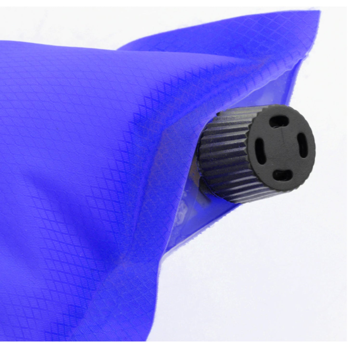Self-inflating camping pillow in use inside tent at campsite showing comfortable head support for backpacking and outdoor sleep