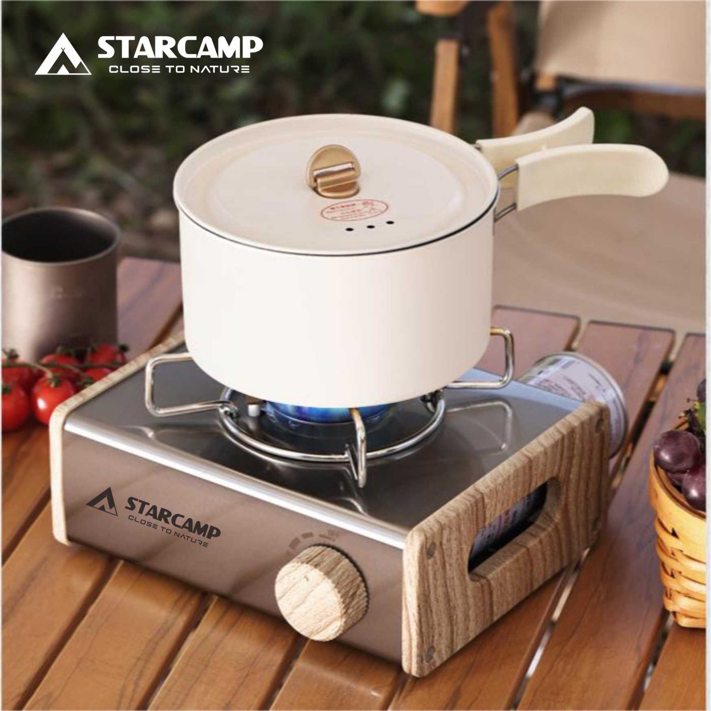 Starcamp portable stove with a white pot on a wooden surface