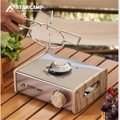 Starcamp portable stove on a wooden surface with outdoor setting