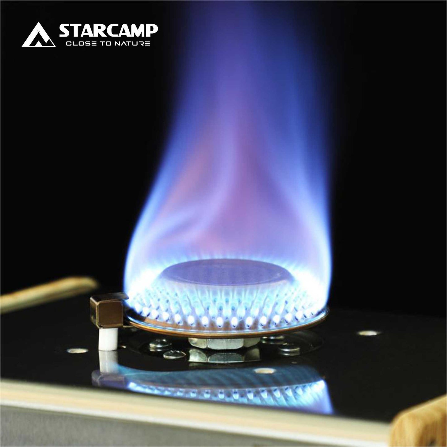 Gas stove burner with blue flame on a black background, featuring the Starcamp logo.