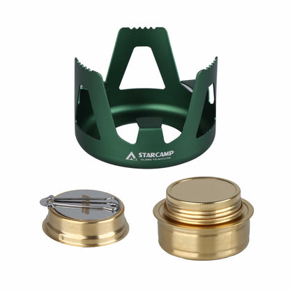 Green camping stove with gold components on a white background, featuring the Starcamp brand.