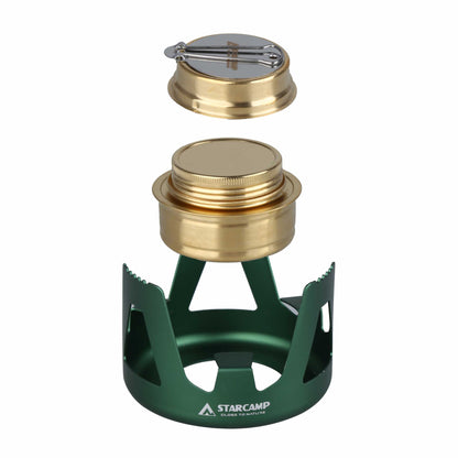 Green camping stove with gold top on a white background, featuring the Starcamp brand.