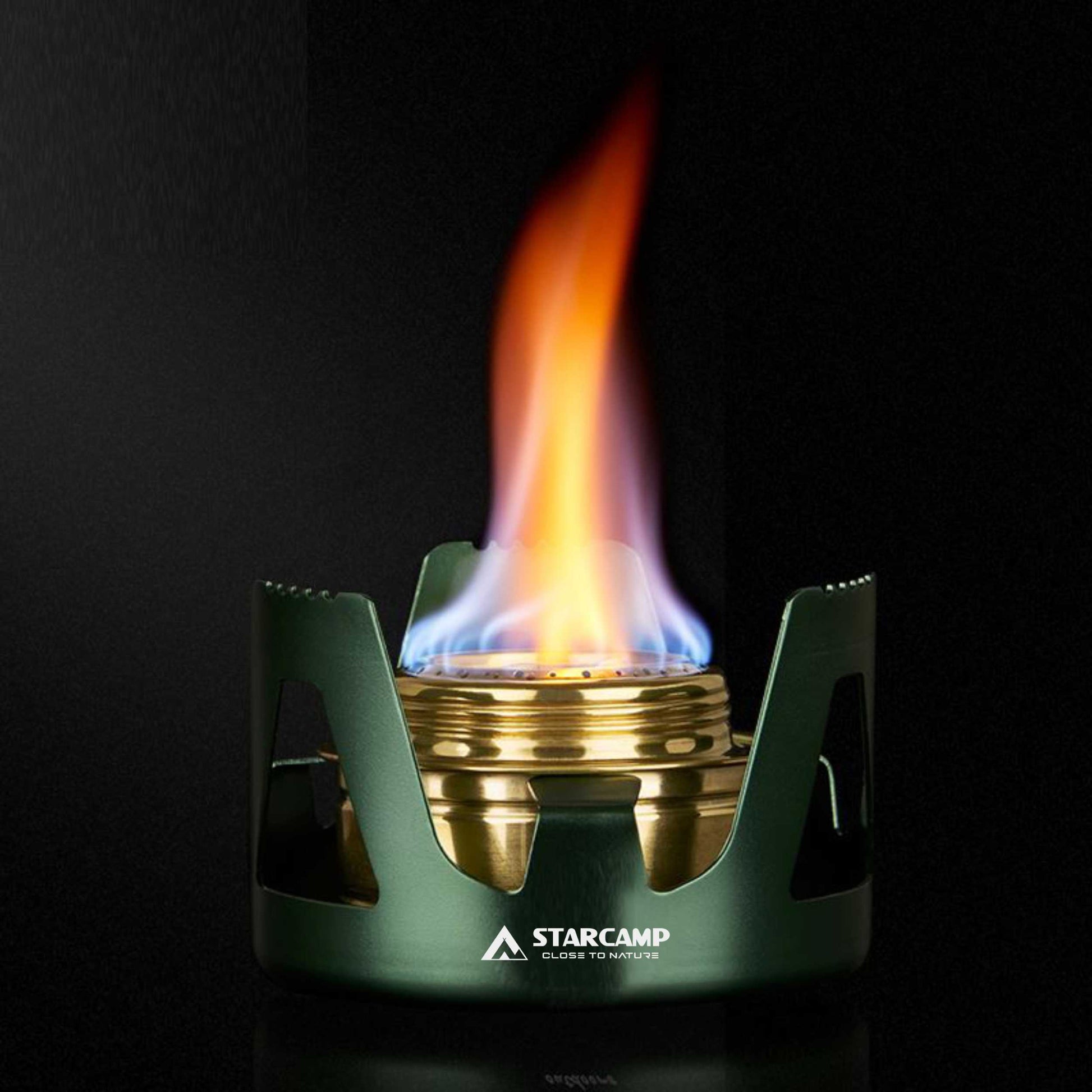 Green and gold camping stove with flame on a black background, featuring the Starcamp brand.
